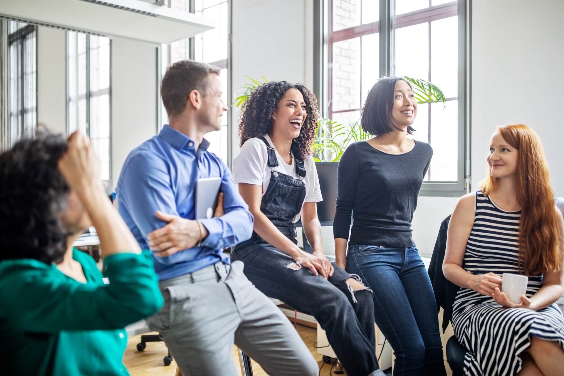 employees meeting and laughing